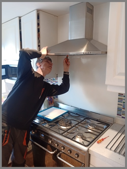 Kitchen hood installer in Liverpool working safely on commercial ventilation